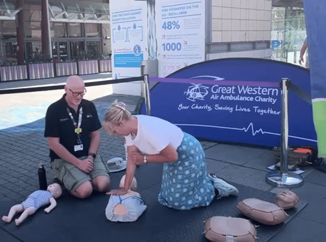 People learn CPR at an event which saw the installation of the defibrillator in Millenium Square.