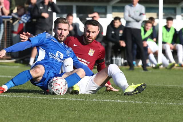 George Rigg playing for Chippenham Town in the FA Cup First Round match against Northampton Town in 2019.