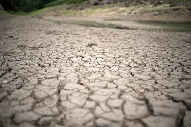  The dried out bed and reduced water levels in the Thruscross reservoir are partially depleted in the heatwave.