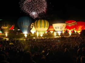 Hot air balloons are seen at the night glow at the International Balloon Fiesta in Bristol  (Photo by Matt Cardy/Getty Images).