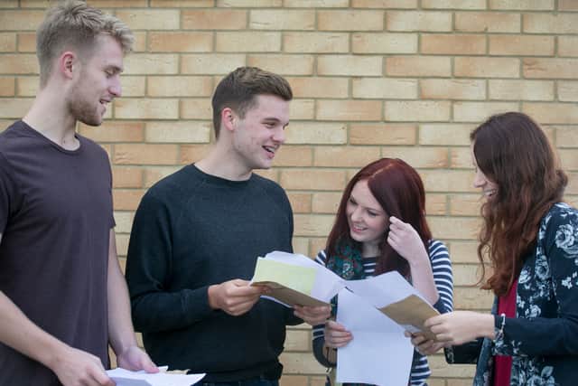 Students who received their results at Winterbourne International Academy react with joy as they received their A Level results.