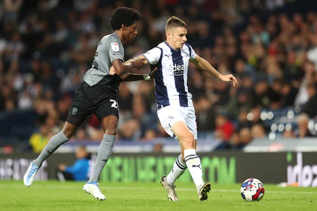 Conor Townsend of West Bromwich Albion is challenged by Jaden Philogene-Bidace of Cardiff City during the Sky Bet Championship between West Bromwich Albion and Cardiff City