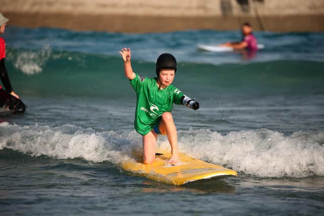  The prosthetic arm has given Joanie the confidence to surf