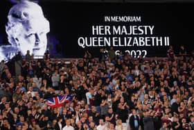 The LED board shows a photo Queen Elizabeth II as players observe a minutes silence after it was announced that Queen Elizabeth II has passed away today prior to the UEFA Europa Conference League group B match between West Ham United and FCSB at London Stadium