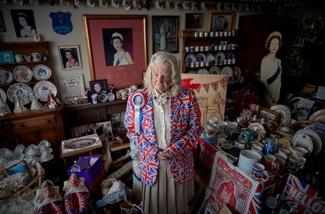 Margaret Tyler, 78, superfan of Queen Elizabeth II who has branded herself as Britain’s ‘most loyalist Royalist’, stands in her dinning room reflecting on the death of Queen Elizabeth II on September 10, 2022 in Wembley, England. 