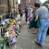Floral tributes to the scene outside Bristol Cathedral 