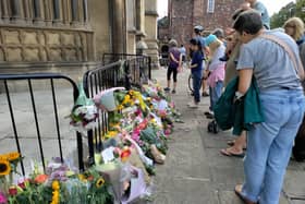 Floral tributes to the scene outside Bristol Cathedral 