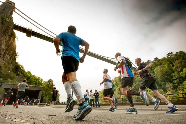 Pictured are runners in the Great Bristol Run dashing under the Clifton Suspension Bridge.