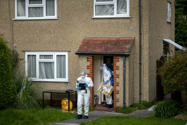 Forensic teams at the property in Chipperfield Drive where the incident took place