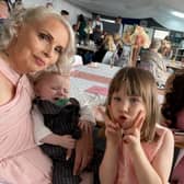 A mum of two has spoken out about her harrowing experience being trapped in a 16th floor flat with her children during a fire that killed her next-door neighbour