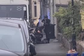Armed police arrest a man in Easton as neighbours watch on (Credit: Rob Bryher)