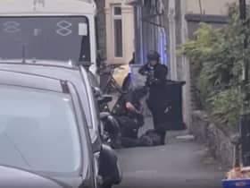 Armed police arrest a man in Easton as neighbours watch on (Credit: Rob Bryher)