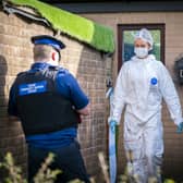 Forensic officers at the property in Parson Paddock