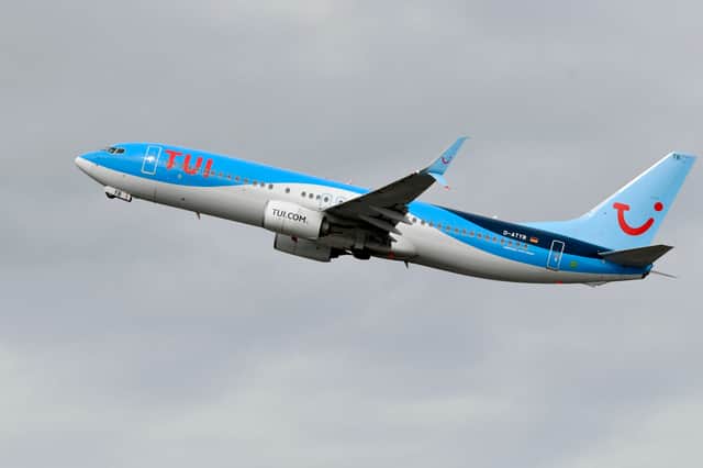 A Boeing 737-800 of the TUI airline during take-off.