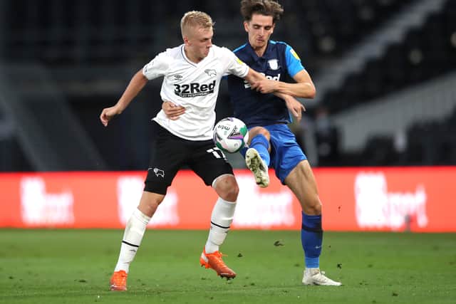Tom Bayliss (R) battles for the ball for Preston North End in 2020