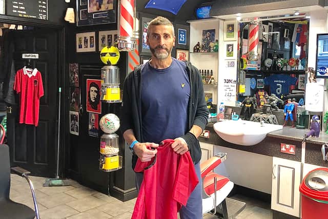 Barber Lee Bavetta says the council should take out a Compulsory Purchase Order on the land behind his shop in Stockwood
