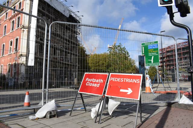 The pavement and cycle path outside the Grosvenor Hotel remains closed a week after the blaze