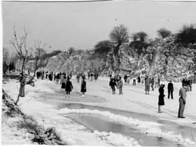 Crowds gather on the frozen Henleaze lake. 
