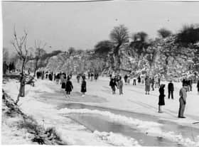 Crowds gather on the frozen Henleaze lake. 