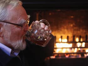  A drinker enjoys a pint of beer which is currently being sold in outlets of the pub chain JD Wetherspoon for 99p a pint on January 5, 2009 in Bristol, England. 