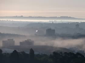 Morning mist lingers over Bristol seen from a hot air balloon as it flies from the Bristol International Balloon Fiesta main arena at the Ashton Court estate.