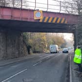 A man remains in police custody after a lorry smashed through a railway bridge in Oldland Common.