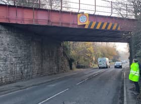 A man remains in police custody after a lorry smashed through a railway bridge in Oldland Common.