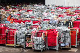 These photos taken 17 hours apart show the same heaps of post left outside a major Royal Mail centre - as fears grow strikes could ruin Christmas. Chaotic scenes of undelivered post were pictured at a mail centre in Bristol both yesterday and today.