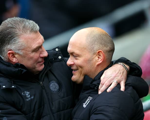 Nigel Pearson embraces Stoke City manager Alex Neil before their two side’s clashed on Saturday. 