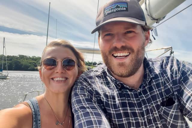 Paddy Vasey, 28, and Esmée Heath, 26 on their boat which they hope to sail around the globe