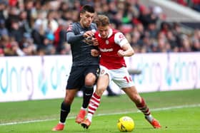 Joel Piroe of Swansea City battles for possession with Cameron Pring 
