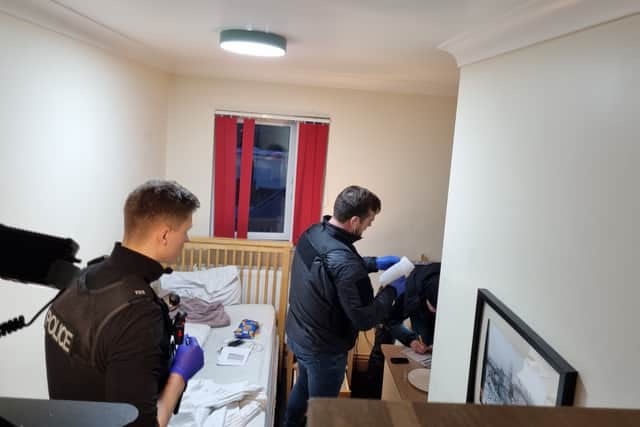 Officers search the bedsit in Filton