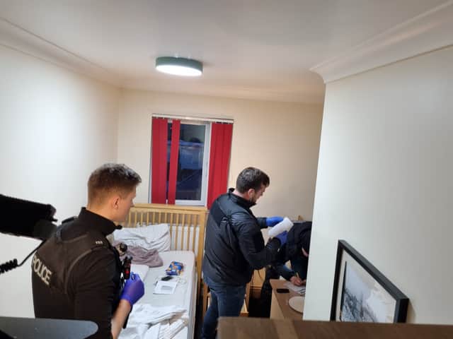 Officers search the bedsit in Filton