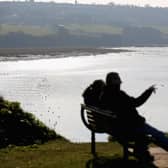 People take in the view from the coastal path above the Severn Estuary at Portishead.