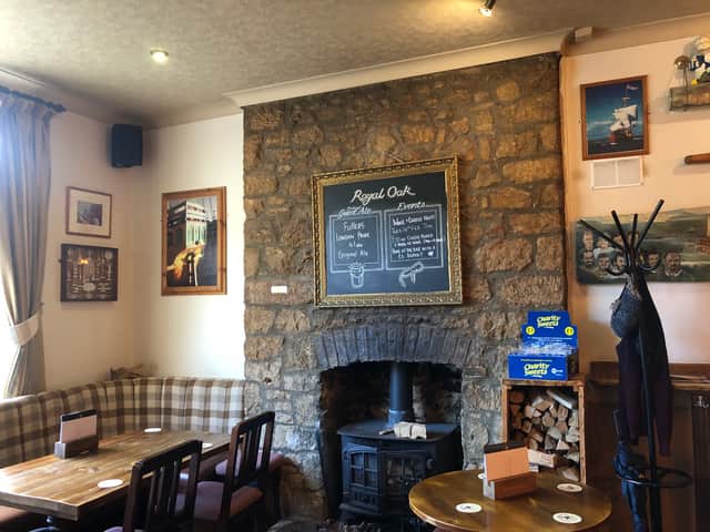 The front bar of the Royal Oak is heated by a woodburner