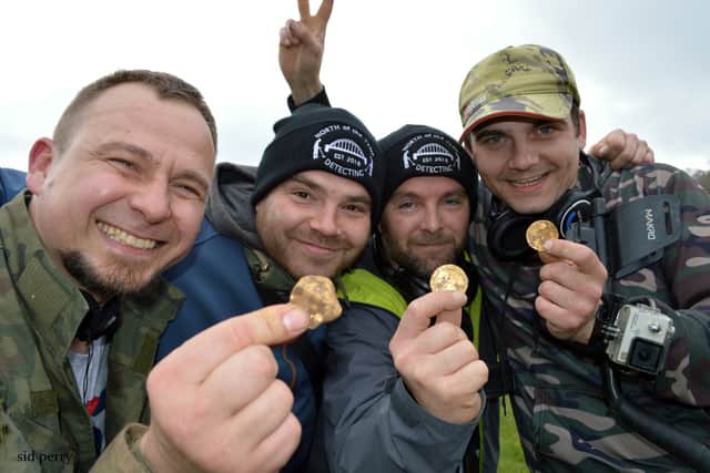 Detectorists Dariusz Fijalkowski , Mateusz Nowak , Andrew Winter and Tobiasz Nowak uncovered a hoard of 14th century coins in a field (pic: SWNS)
