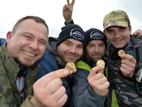 Detectorists Dariusz Fijalkowski , Mateusz Nowak , Andrew Winter and Tobiasz Nowak uncovered a hoard of 14th century coins in a field (pic: SWNS)
