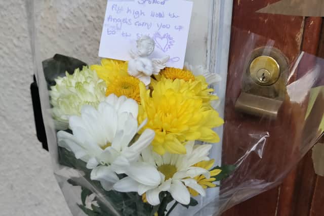 Flowers left outside the man’s address in Dutton Road in Stockwood