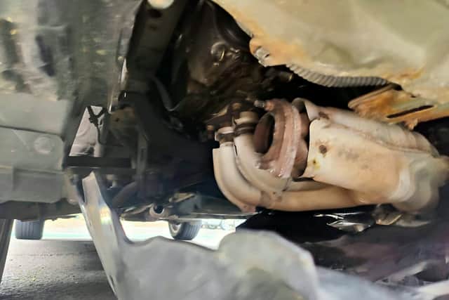 Damage under the car which was found to have its catalytic converter taken
