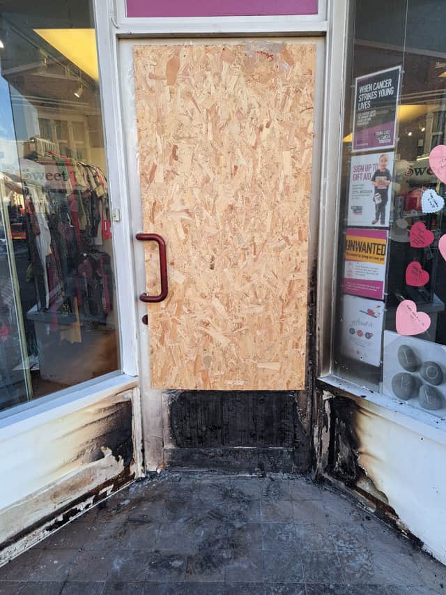 Damaged caused to the front door of the charity shop in Staple Hill