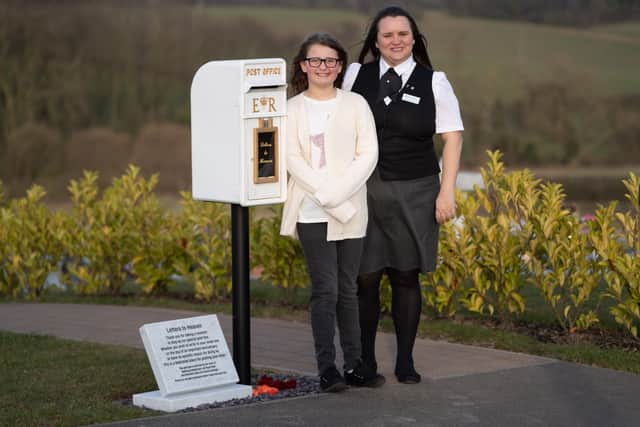 Matilda Handy, 9, and mum, Leanne Handy 45 with their letter box to heaven, in Gedling Crematorium, which allows grieving members of the public to write a letter to their loved ones who have passed away.   (Picture by SWNS)