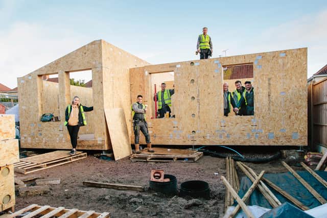 The build crew who built a new house for a homeless man under a pioneering scheme where carbon-neutral homes are built in people’s back gardens