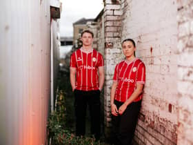 George Tanner and Lia Cataldo wear the new Bristol City 2023/24 home shirt. (Rogan/Fever Pitch)