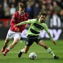 Alex Scott in action against Manchester City’s Bernardo Silva. (Image: Getty Images) 