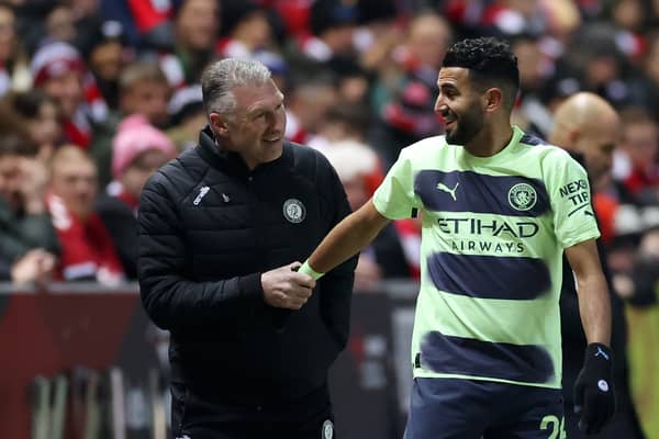Riyad Mahrez of Manchester City interacts with Nigel Pearson, Manager of Bristol City, during the Emirates FA Cup Fifth Round match between Bristol City and Manchester City at Ashton Gate. (Photo by Catherine Ivill/Getty Images)
