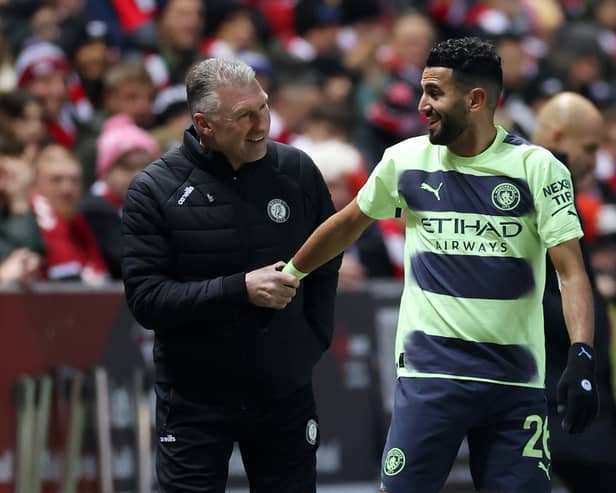 Nigel Pearson and Riyad Mahrez share a light-hearted chat. (Photo by Catherine Ivill/Getty Images)