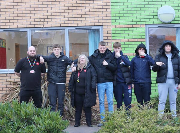 Creative Youth Network youth work manager Jack Fitzsimmons and The Batch lead youth worker Gill Johnson alongside young people attending the newly reopened youth club in Cadbury Heath