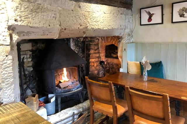 The cosy real fire at the Cross Guns, which attracts walkers, cyclists and tourists (photo: Mark Taylor)