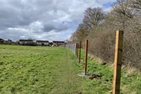 Fencing going up the field off Minsmere Road in Keynsham where Taylor Wimpey plan to build 70 new homes