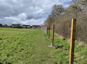 Fencing going up the field off Minsmere Road in Keynsham where Taylor Wimpey plan to build 70 new homes